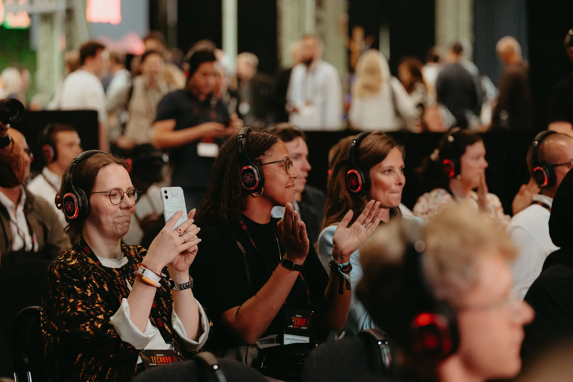 TechBBQ attendees wearing headphones during a session